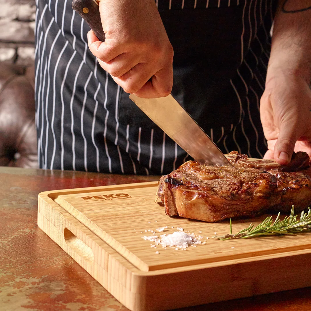 Nhdesign project PEKO & Co.: Professional Chef Bamboo Cutting Board with Peko's logo