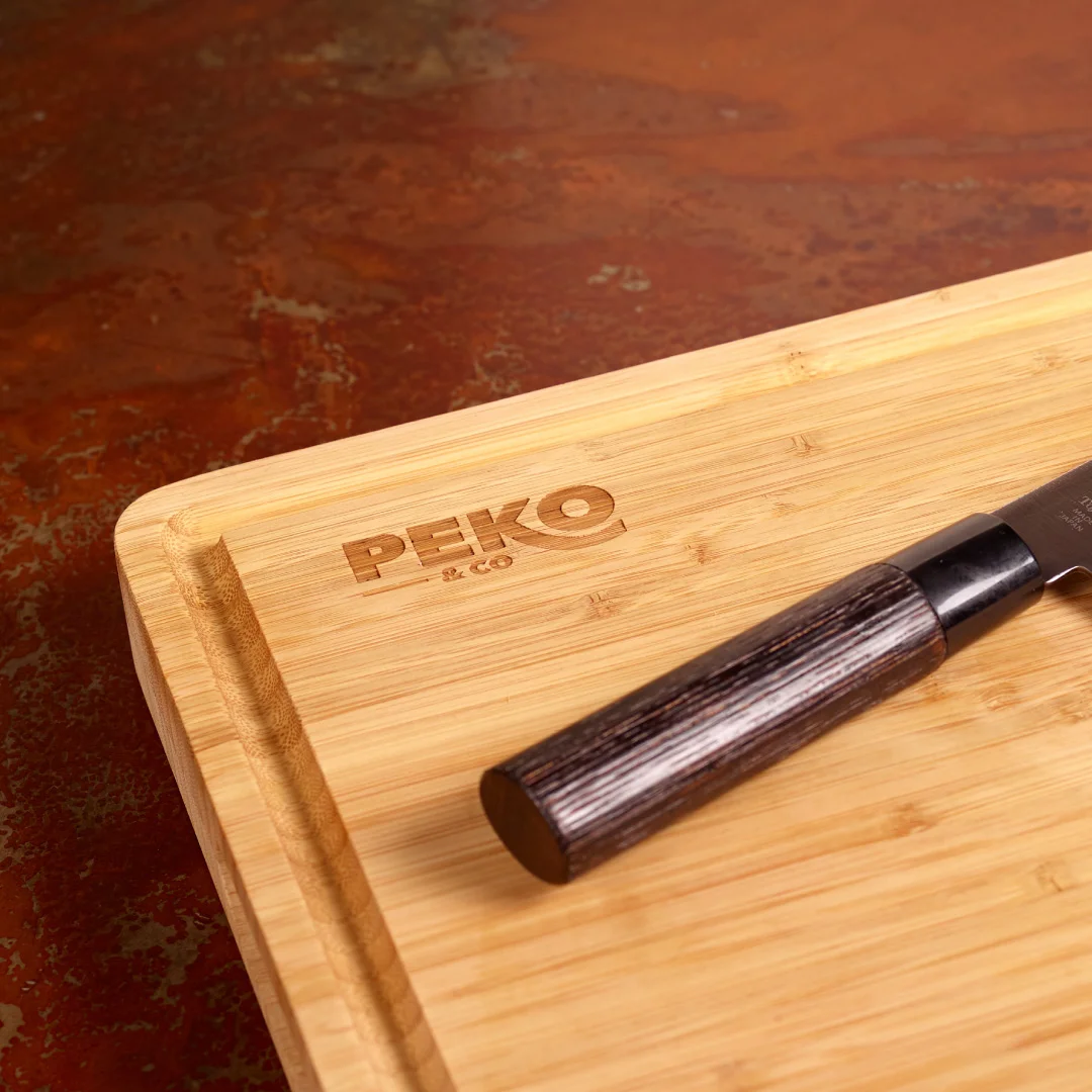 Nhdesign project PEKO & Co.: Professional Chef Bamboo Cutting Board with Peko's logo
