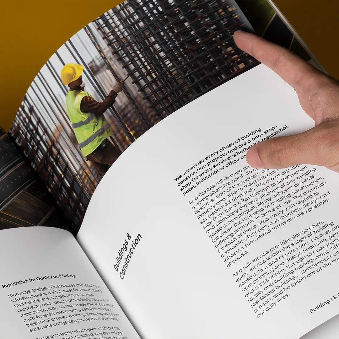 Nhdesign project Rango Company Profile: Inside page of the company profile featuring a construction photo and institutional text.