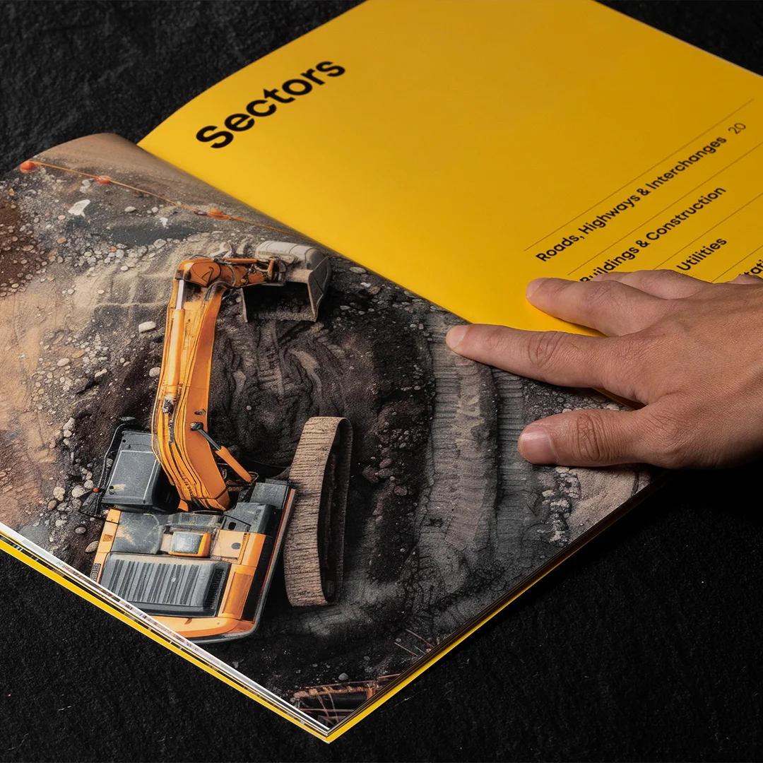 Nhdesign project Rango Company Profile: Inside page of the company profile showing construction machinery.